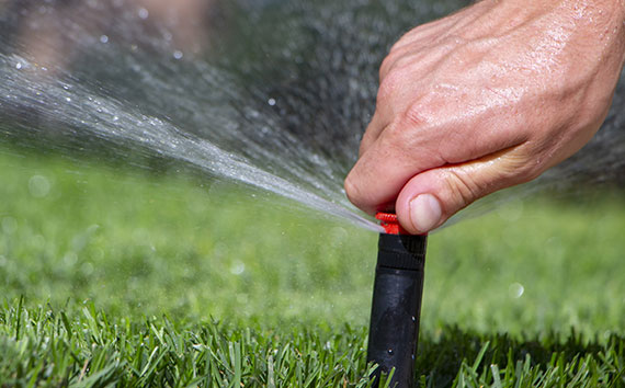 hand adjusting automatic sprinkler system