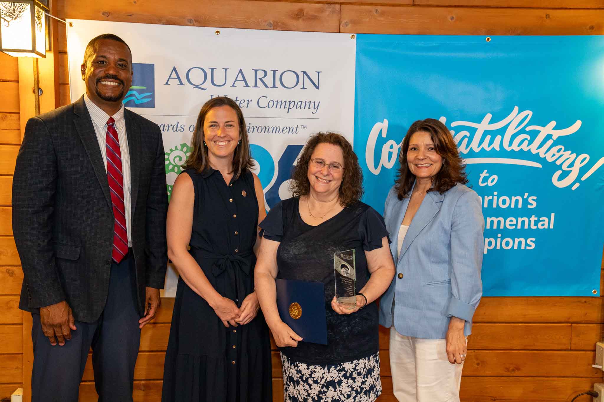 PHOTO (left to right): George Logan, Director of Community Relations at Aquarion Water Company; Ashley Gaudiano, Trumbull Town Council Chair; Sheryl Baumann, Director of the Trumbull Nature & Arts Center; and Lucy Teixeira, President of Aquarion Water Company.